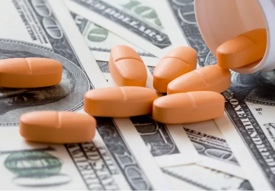 Medication and money representing cost containment